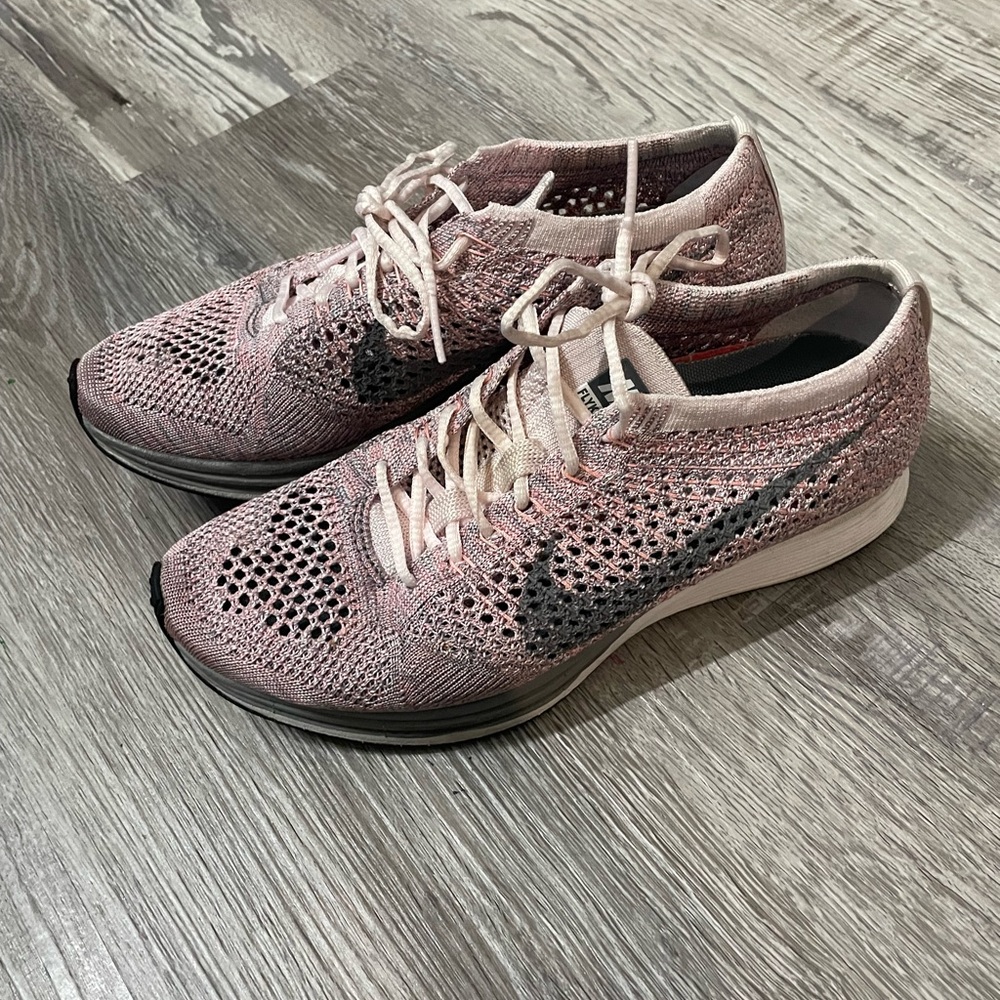 Nike Women's Pink and Black flyknit racers